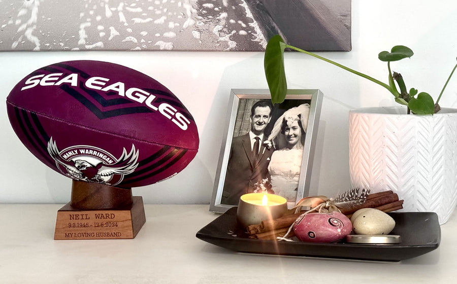 Sea Eagles ball in stand with personalisation, a cremation urn for ashes